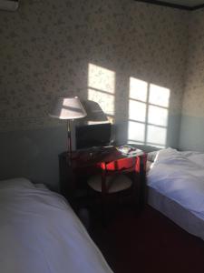 Postel nebo postele na pokoji v ubytování Chateau Lausanne