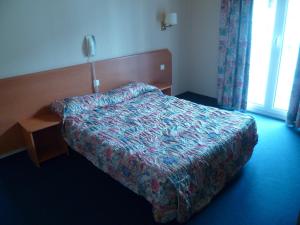 Letto o letti in una camera di Hôtel Gloria & Avenue