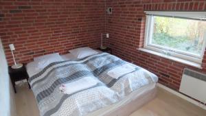 En eller flere senge i et værelse på BLÅBJERGGAARD - Hennebysvej 58