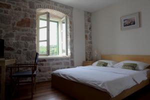 Postel nebo postele na pokoji v ubytování Hotel Maestral