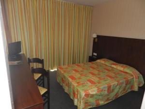 Letto o letti in una camera di Hôtel Gloria & Avenue