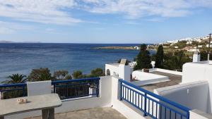 a view of the ocean from the balcony of a house at Galazio Kyma in Agios Ioannis