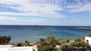 a view of the ocean from a building at Galazio Kyma in Agios Ioannis