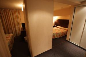 Letto o letti in una camera di Hôtel Gloria & Avenue