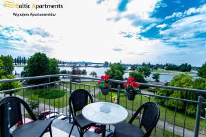 A balcony or terrace at Baltic Apartments - Apartamenty Bałtyk Bay View