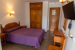Postel nebo postele na pokoji v ubytování Hotel Herasu