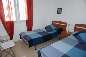 Posteľ alebo postele v izbe v ubytovaní Oasis Park Susana