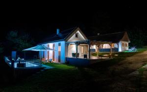 a house lit up at night with at GORIČKE IŽE in Križevci