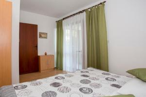 Posteľ alebo postele v izbe v ubytovaní Apartment Puh