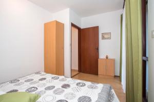 Posteľ alebo postele v izbe v ubytovaní Apartment Puh