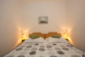 Posteľ alebo postele v izbe v ubytovaní Apartment Puh