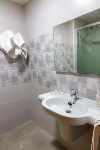 Koupelna v ubytování Hotel Herasu