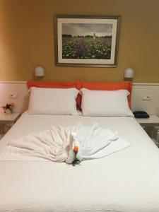 Postel nebo postele na pokoji v ubytování Hotel Nais