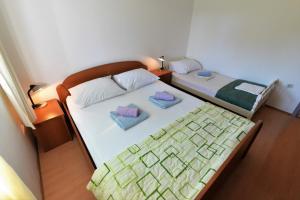 Posteľ alebo postele v izbe v ubytovaní Slanica Murter