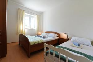Posteľ alebo postele v izbe v ubytovaní Slanica Murter