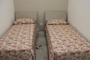 Lova arba lovos apgyvendinimo įstaigoje Appartamento a pochi metri dal mare La Giara