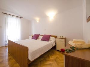 Кровать или кровати в номере Apartments Patricija