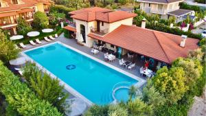 an aerial view of a house with a swimming pool at Renka Hotel & Spa in G&ouml;cek