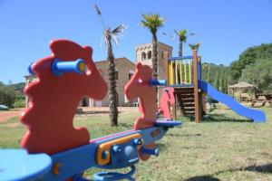Lasten leikkialue majoituspaikassa Agriturismo La Fontanella & Glamping