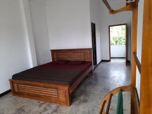Katil atau katil-katil dalam bilik di Aruliya care Resort and Spa