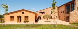 an external view of a building with a courtyard at Casa Anamaria Hotel in Ollers