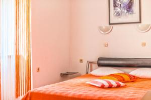 Postel nebo postele na pokoji v ubytování Apartments Salčinović