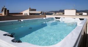 a swimming pool on the roof of a building at Villa Molinar in Palma de Mallorca