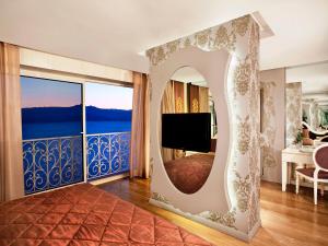 a bedroom with a view of the ocean at La Boutique Hotel & Suites - Adults Only in Antalya