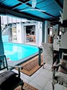 a swimming pool with a table and chairs on a patio at The Place Guesthouse Parys in Parys