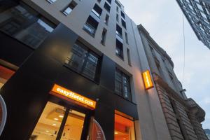 a building with a sign on the front of it at easyHotel Brussels City Centre in Brussels