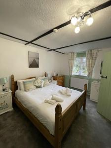 a bedroom with a large bed with towels on it at Playden Oasts Hotel in Rye