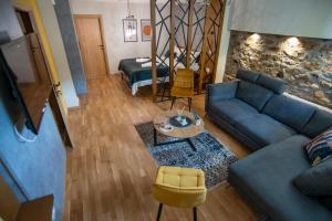a living room with a couch and a table at Boutique Hotel St Nikolas by Skar in Kruševo