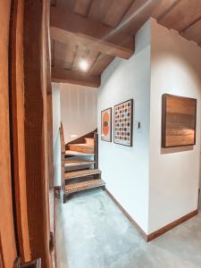 a staircase in a house with wooden ceilings at Villa Gaida in Saulkrasti