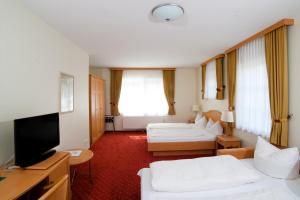 TV a/nebo společenská místnost v ubytování Hotel Witthus GmbH & CoKG