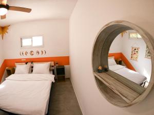 מיטה או מיטות בחדר ב-Odem Guest House