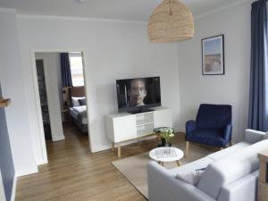 TV a/nebo společenská místnost v ubytování Hotel Witthus GmbH & CoKG
