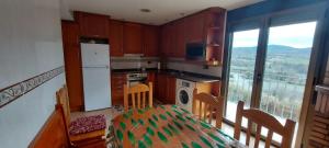 Kuchyň nebo kuchyňský kout v ubytování Casa Féliz duplex y apartamento Rural