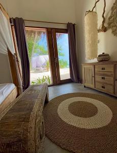 Voodi või voodid majutusasutuse Samura Maldives Guest House Thulusdhoo toas