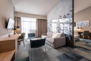 TV a/nebo společenská místnost v ubytování Globall Hotel