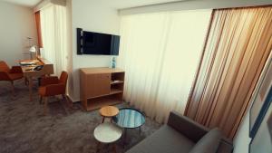 TV a/nebo společenská místnost v ubytování Hotel Adler Asperg