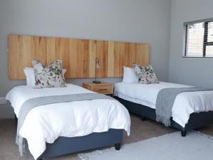 Ένα ή περισσότερα κρεβάτια σε δωμάτιο στο Elements Bush Lodge +12 φωτογραφίες