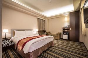 Voodi või voodid majutusasutuse Country Garden Hotel toas