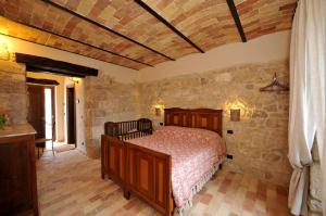 Postel nebo postele na pokoji v ubytování Agriturismo Borgo San Martino