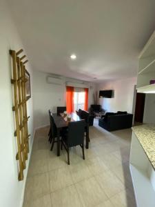 a kitchen and living room with a table and chairs at RondPoint Pilar in Pilar