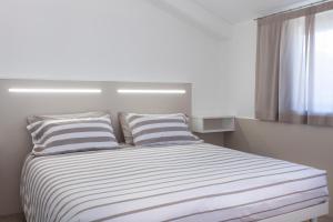 A bed or beds in a room at Bed & Bike