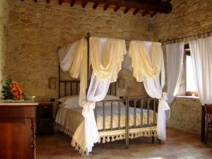 Postel nebo postele na pokoji v ubytování Agriturismo Borgo San Martino