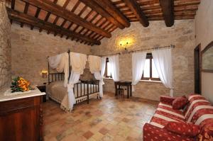 Postel nebo postele na pokoji v ubytování Agriturismo Borgo San Martino