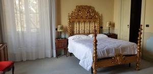 Llit o llits en una habitació de Villa Cagnola