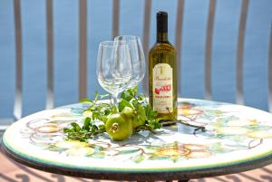 a bottle of wine and a glass on a table at Il Barilotto in Positano