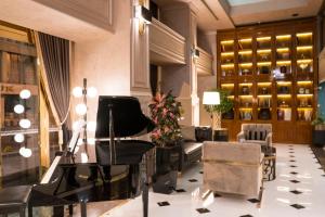 a lobby with a piano and a living room at Beethoven Premium Hotel in Istanbul